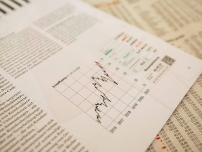 Close-up of financial documents showing investment performance metrics