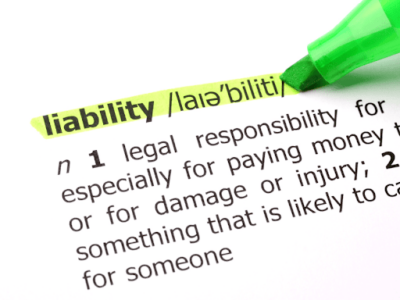 A close-up of the dictionary definition of “liability”